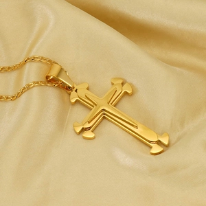 Three-layer gold stainless steel cross pendant necklace on luxury champagne satin background