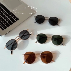 Vintage round frame sunglasses in multiple colors with metallic thin frame and retro style