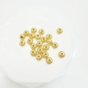 Group of 18k gold lantern-patterned circular spacers and beads for DIY jewelry