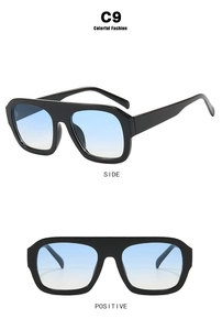 Detail view of large square sunglasses with black frames and blue gradient lenses