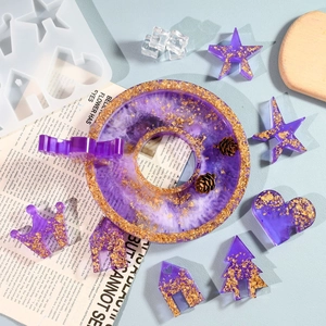 Purple resin angel house craft kit with gold foil inclusions and various geometric shapes