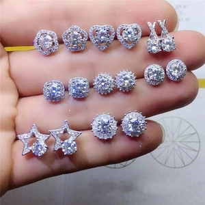 Detailed set of silver zircon earrings featuring star, heart, and flower patterns