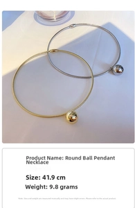 Detail view of 41.9cm metal choker with polished spherical pendant in minimalist style
