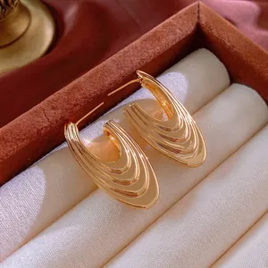 Luxury gold-plated U-shaped layered wave earrings in a velvet jewelry gift box
