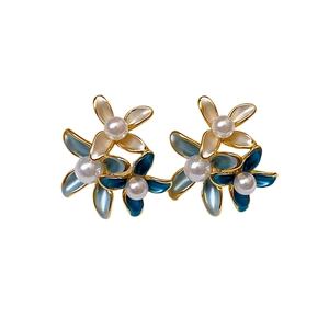 Elegant gold plated flower earrings with blue gradient petals and pearl accents