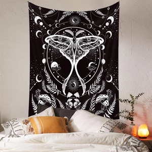 Detail of moth tapestry featuring moon phases and mushrooms in a bohemian bedroom