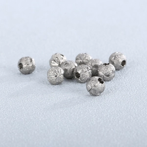 Polished stainless steel beads with sandblasted texture and star patterns for jewelry