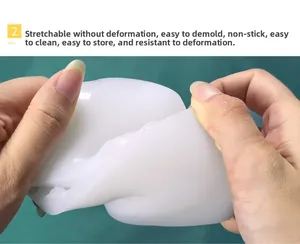 Close-up of flexible white silicone candle mold being stretched to show high elasticity