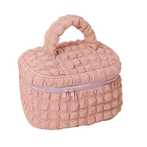 Pink textured bubble puff makeup bag with large capacity handle on white background