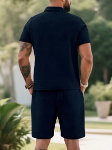 Back view of men's dark blue waffle knit set showing texture and relaxed summer fit