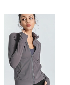 Detail of slim-fit yoga jacket featuring a stand collar and smooth full-zip closure