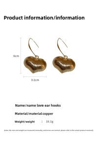 Detail view of gold heart hook earrings with dimensions 6cm by 3.1cm and weight info