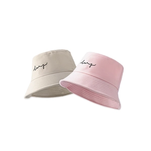 Minimalist wide brim bucket hats for men and women in beige and pink stylish summer colors