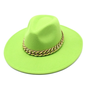 Detail of neon green wool fedora hat featuring a chunky gold metal chain decoration