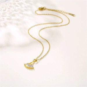 Elegant gold fan-shaped pendant necklace with cubic zirconia stones on an O-chain link