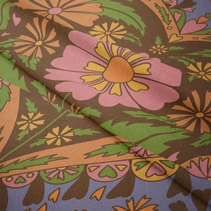 Close-up of bohemian floral tapestry fabric with soft texture and vibrant patterns