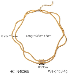 Detailed view of gold double snake chain with square crystal pendant measurements