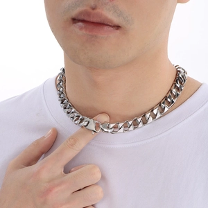 Close-up of a men's chunky silver Cuban link necklace with a secure snap clasp closure