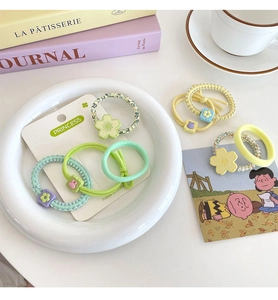 Macaron candy color floral hair ties collection featuring daisy charms and beaded elastic bands