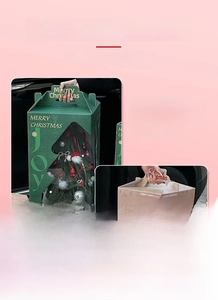 Detail of Christmas tree shaped window on a sturdy cardboard holiday gift box