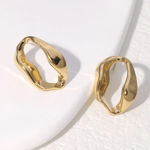 Irregular golden geometric drop earrings with polished metallic finish for women