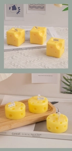 Macro detail of cheese-shaped scented candles with realistic pores and white wicks