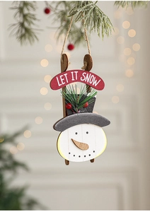 Detail of wooden Let It Snow snowman sled hanging ornament for Christmas tree decor