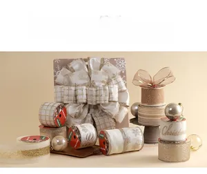 Detail of luxury champagne gold Christmas ribbons with snowflake patterns and glitter bow