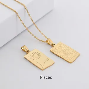 Macro shot of gold Pisces zodiac rectangle pendant with celestial engraving detail