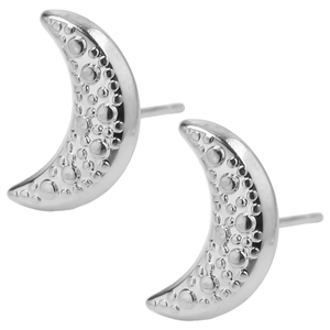 Macro detail of silver crescent moon stud earrings with textured lunar surface