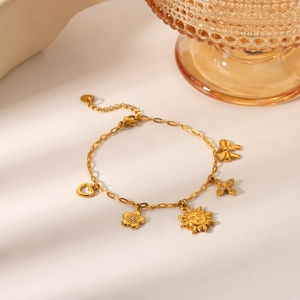 Gold-plated stainless steel charm bracelet with heart, sun and bow pendants for women