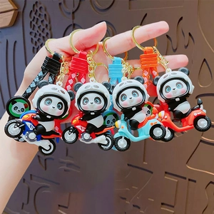 Panda motorcycle keychains with colorful braided wristbands held in a group display