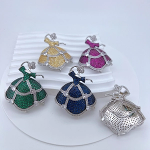 Detailed view of colorful ballet dancer brooches with zircon crystals on a display