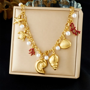 18k gold plated ocean charm bracelet with starfish turtle shell coral and pearl