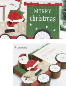 Detail of thick wooden Christmas train ornament with Merry Christmas painted text