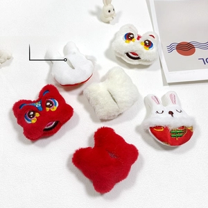Detail of plush rabbit and lion dance patches for DIY hair clips and clothing decor