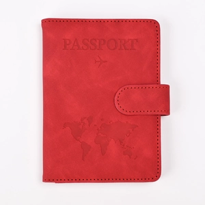 Front view of red RFID blocking PU leather passport holder with world map embossing