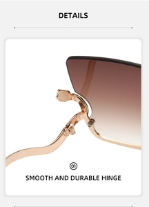 Close-up of golden metal hinge and brown gradient lens on stylish sunglasses