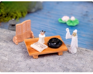 Miniature ancient Chinese scholar scene with poet figurine, desk, and scroll set