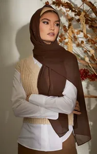 Detail shot of a brown 75D pearl chiffon hijab showing soft drape and lightweight texture