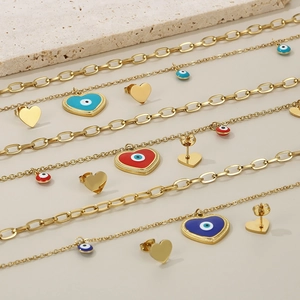 Golden double-layer evil eye necklace and heart earring sets in blue and red enamel
