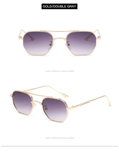 Detail view of gold double-bridge sunglasses with purple to gray gradient lenses
