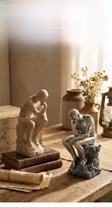 Macro detail of Nordic sandstone thinker bookends in sandstone and silver grey resin