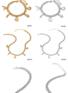 Detailed close-up of ocean-themed starfish and shell pendants on stainless steel jewelry