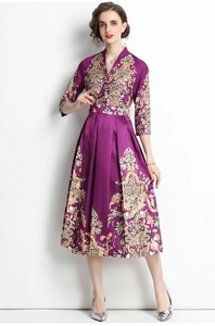 Close-up of elegant purple palace style dress with intricate patterns and satin finish