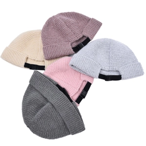 Knitted docker caps for men and women with adjustable back straps and ribbed cuffs