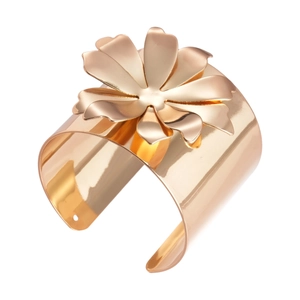 Exaggerated rose gold flower bangle featuring a wide polished metal cuff and floral bloom
