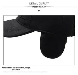 Close-up of the metal SPORTS logo and earflap detail on a winter wool baseball cap