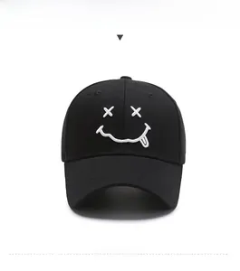 Detailed front view of black baseball cap with white embroidered creative smile face