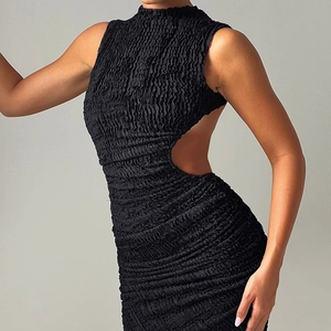 Detail of black textured sleeveless dress with back cutout and high-neck design